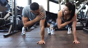 Toning Bingo Wings: Your Ultimate Guide to Sculpting Sleek Arms at the Gym 3 Fitness trainer demonstrating arm toning exercises Shoreham Beach