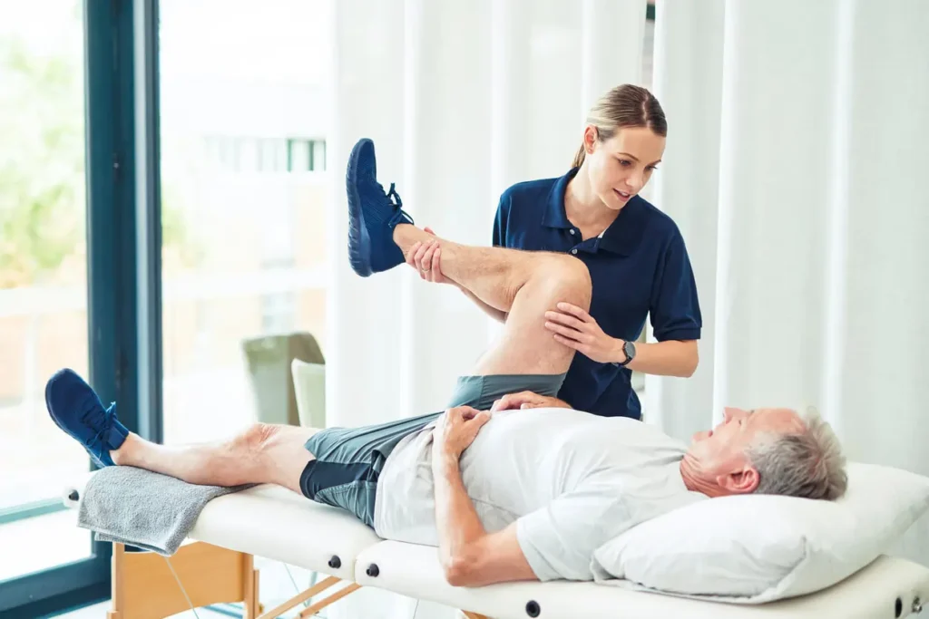 Revitalising Recovery: Effective Rehabilitation Strategies for Muscle Injuries 3 Physiotherapist assisting a patient with muscle recovery exercises Shoreham Beach